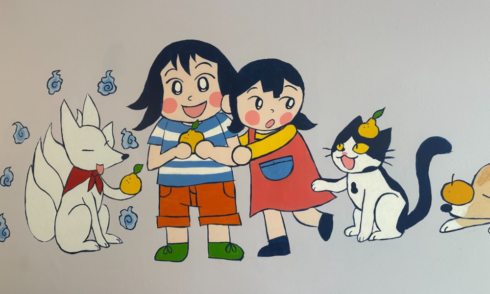 Mural of a white fox, two smiling children, and a black and white cat.