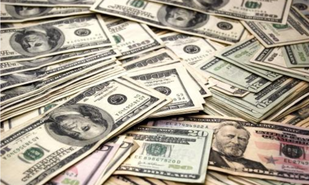 Photograph of a lot of dollar bills.