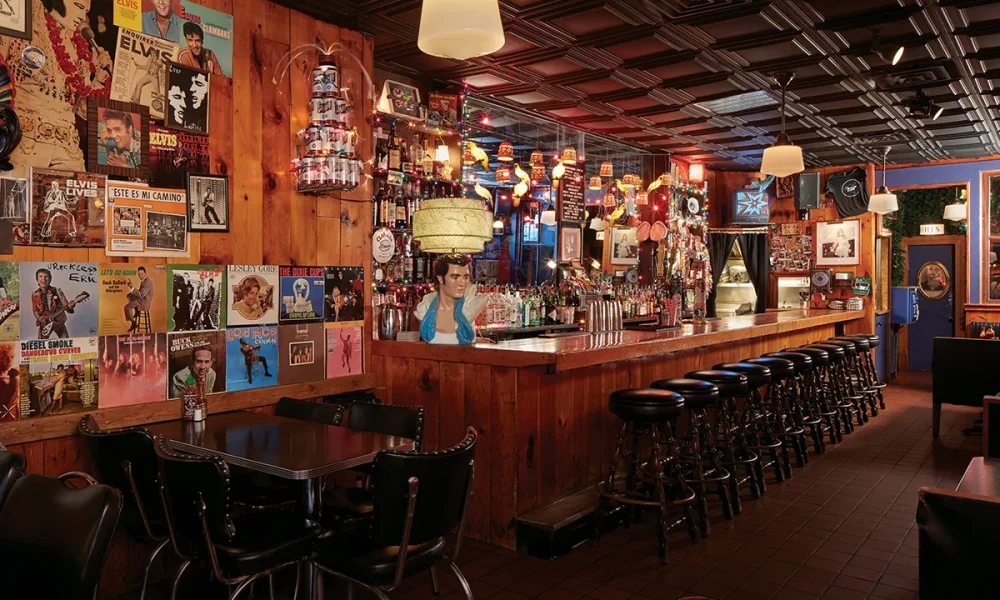 Inside the Delux Cafe. Lots of funky lamps and fun postcards on the walls.