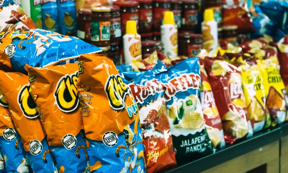 Photo of bags of chips in store. Photo courtesy of Ishaq Robin on Unsplash.